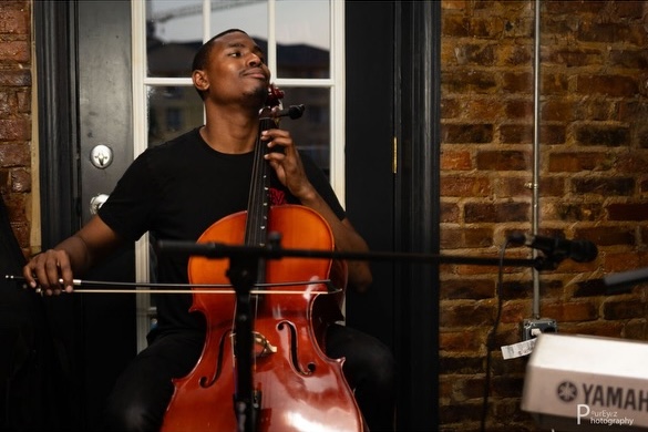 photo of Ivan, head back, passionately playing his cello in the sidebar